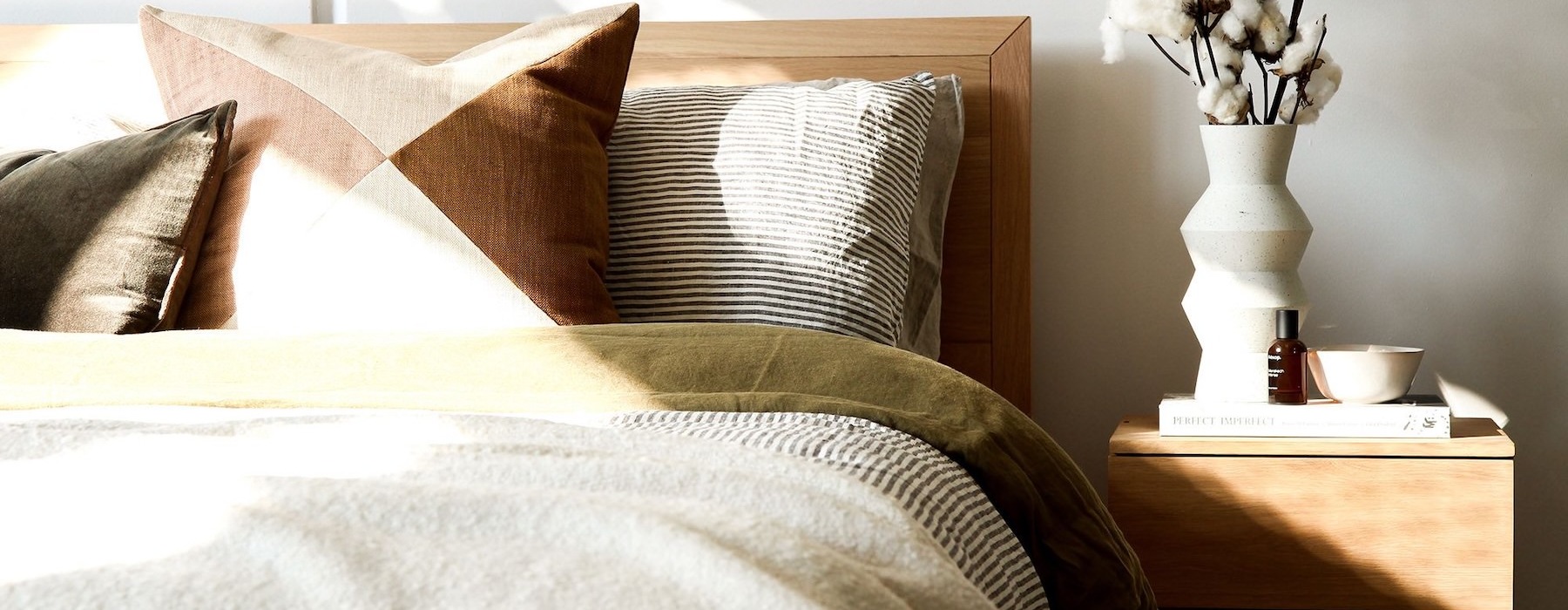 a bedroom with a nightstand and a  dresser